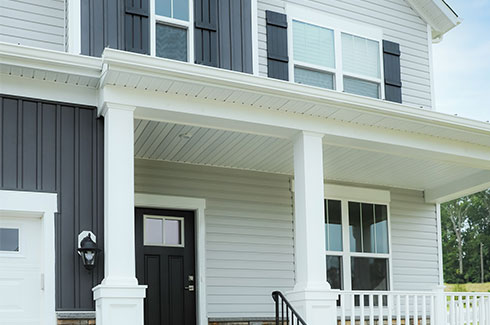 New house showing front door and upstairs windows